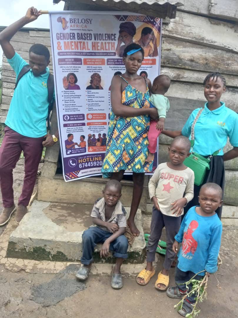 Volunteers sensitising a mother and her children on gender-based violence