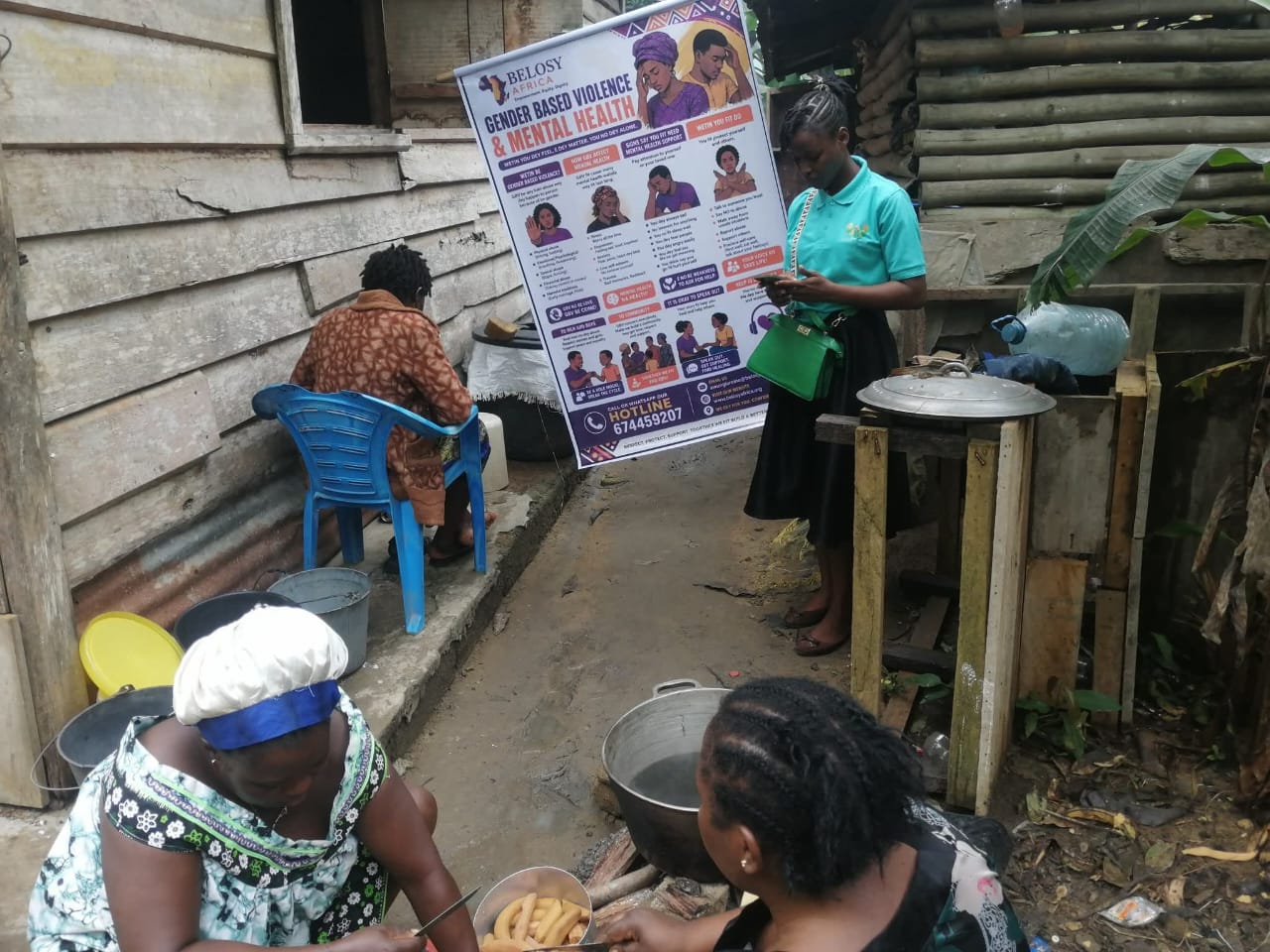 A Belosy Africa volunteer speaking with women at their home