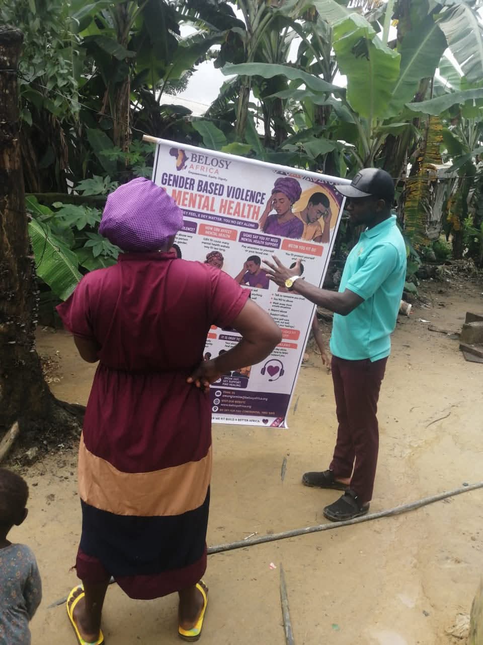 A Belosy Africa volunteer speaking with a community member about gender-based violence