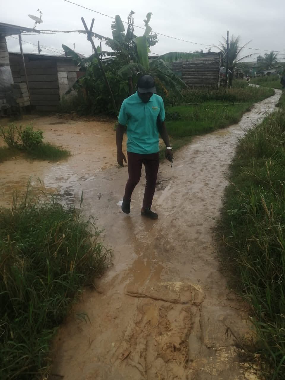 A Belosy Africa volunteer walking through a community during outreach